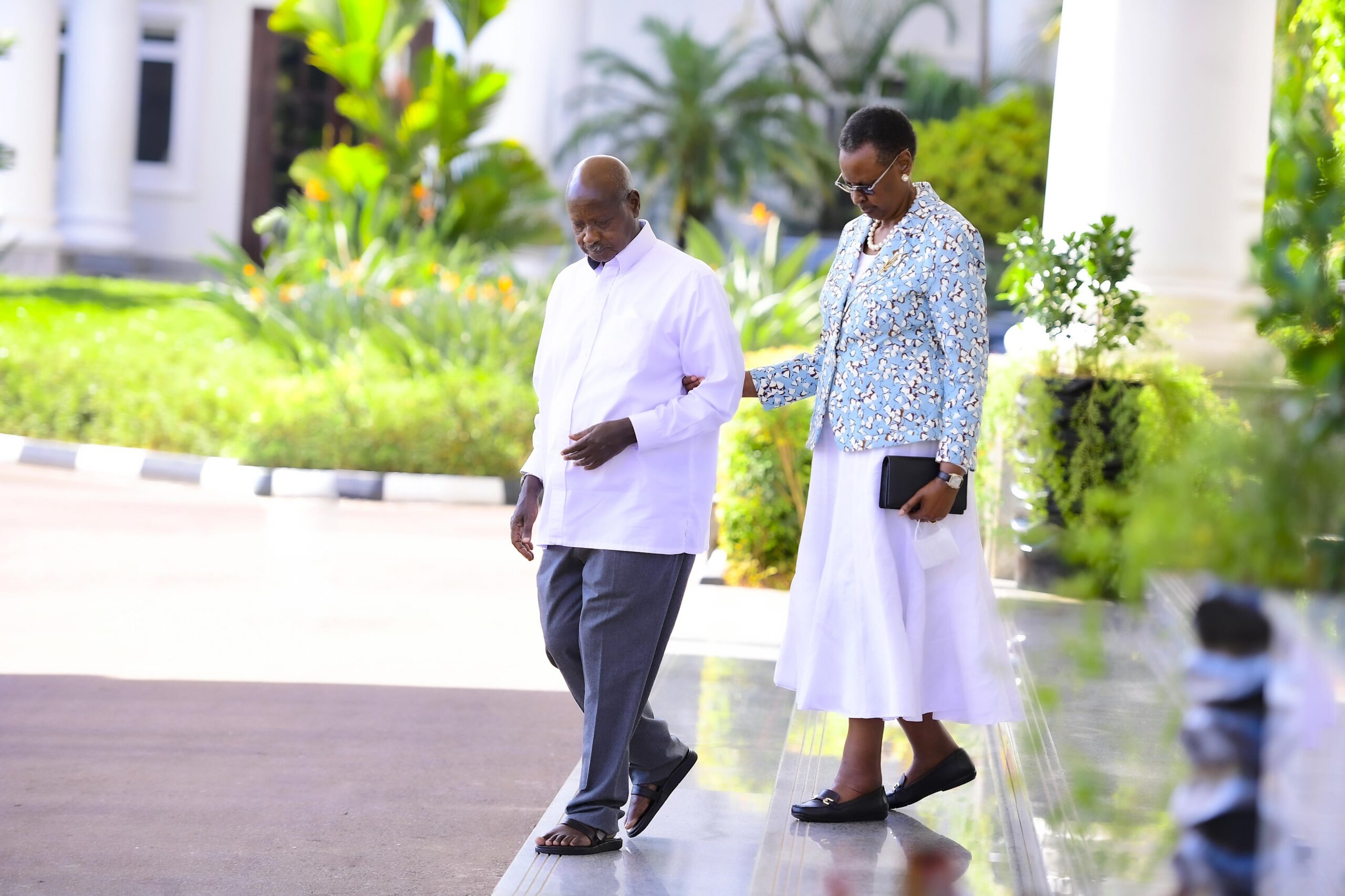 Museveni walking with Janet Kataha