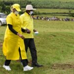Museveni walking with Janet Kataha