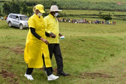 Museveni walking with Janet Kataha