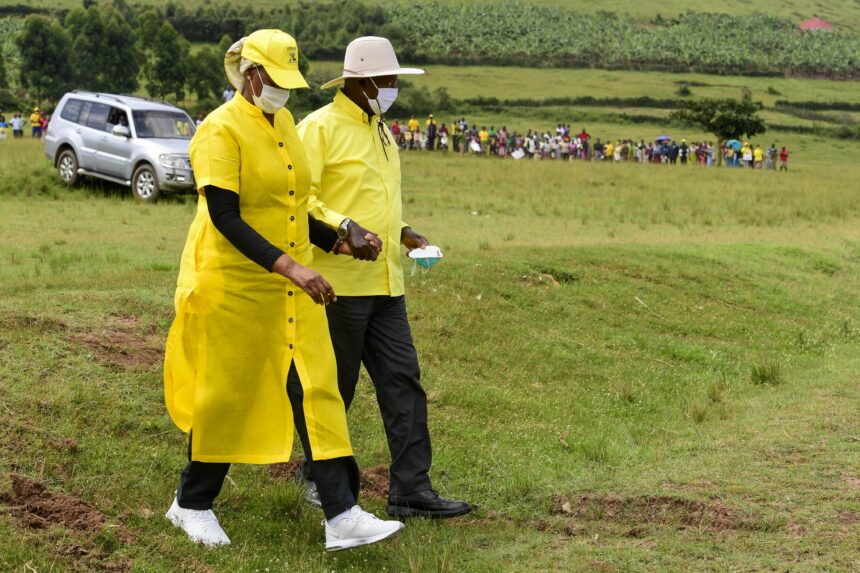 Museveni walking with Janet Kataha