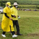 Museveni walking with Janet Kataha