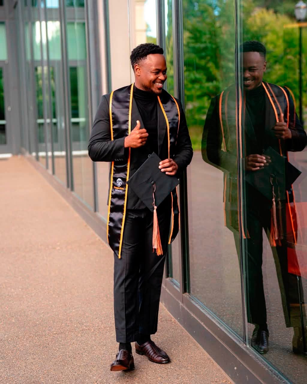 Catherine Kusasira celebrates her son's graduation.