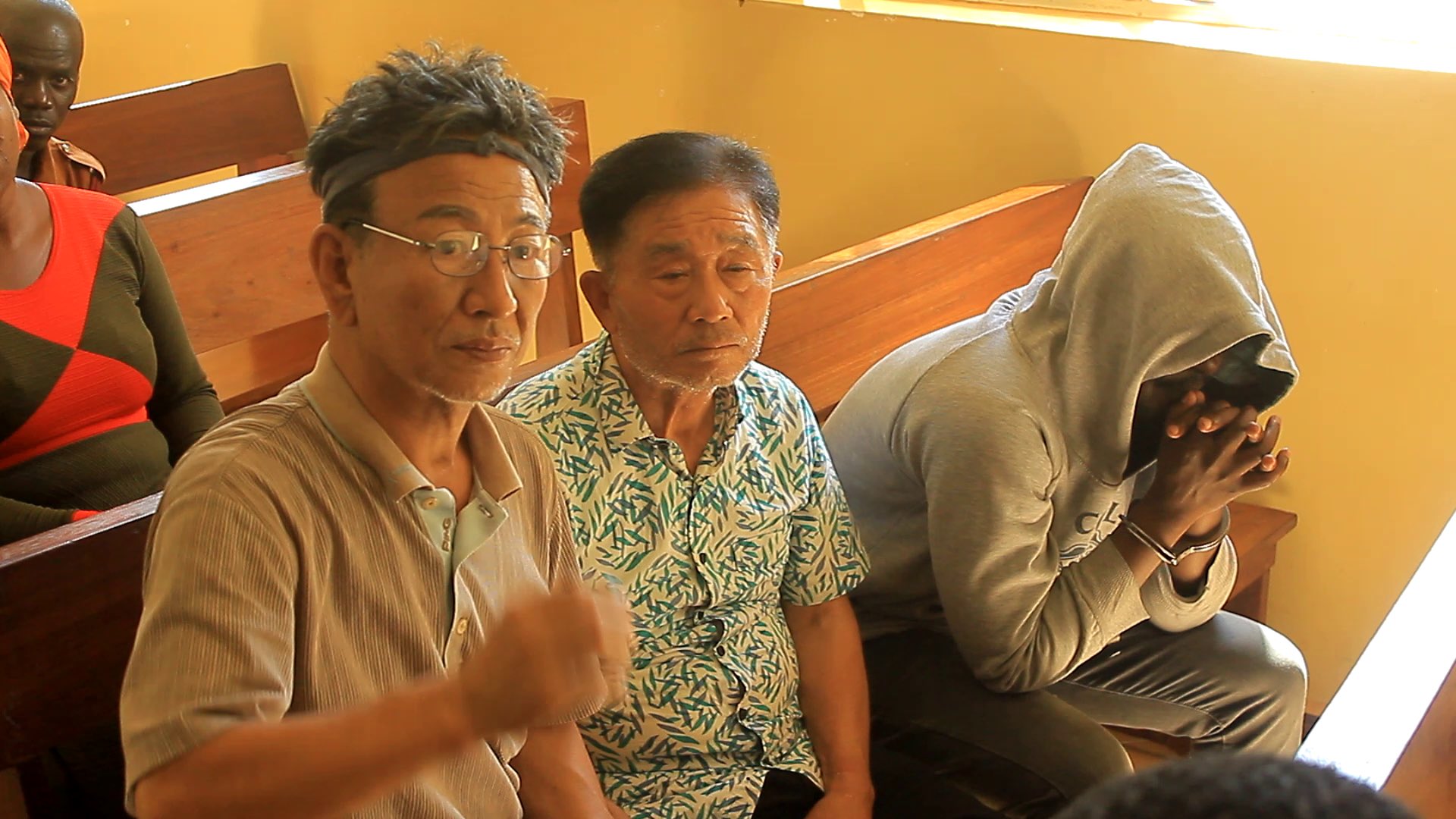 Two South Korean nationals and a Ugandan lawyer remanded.