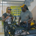 Fik Fameica receives a Spiro Ekon electric motorcycle.